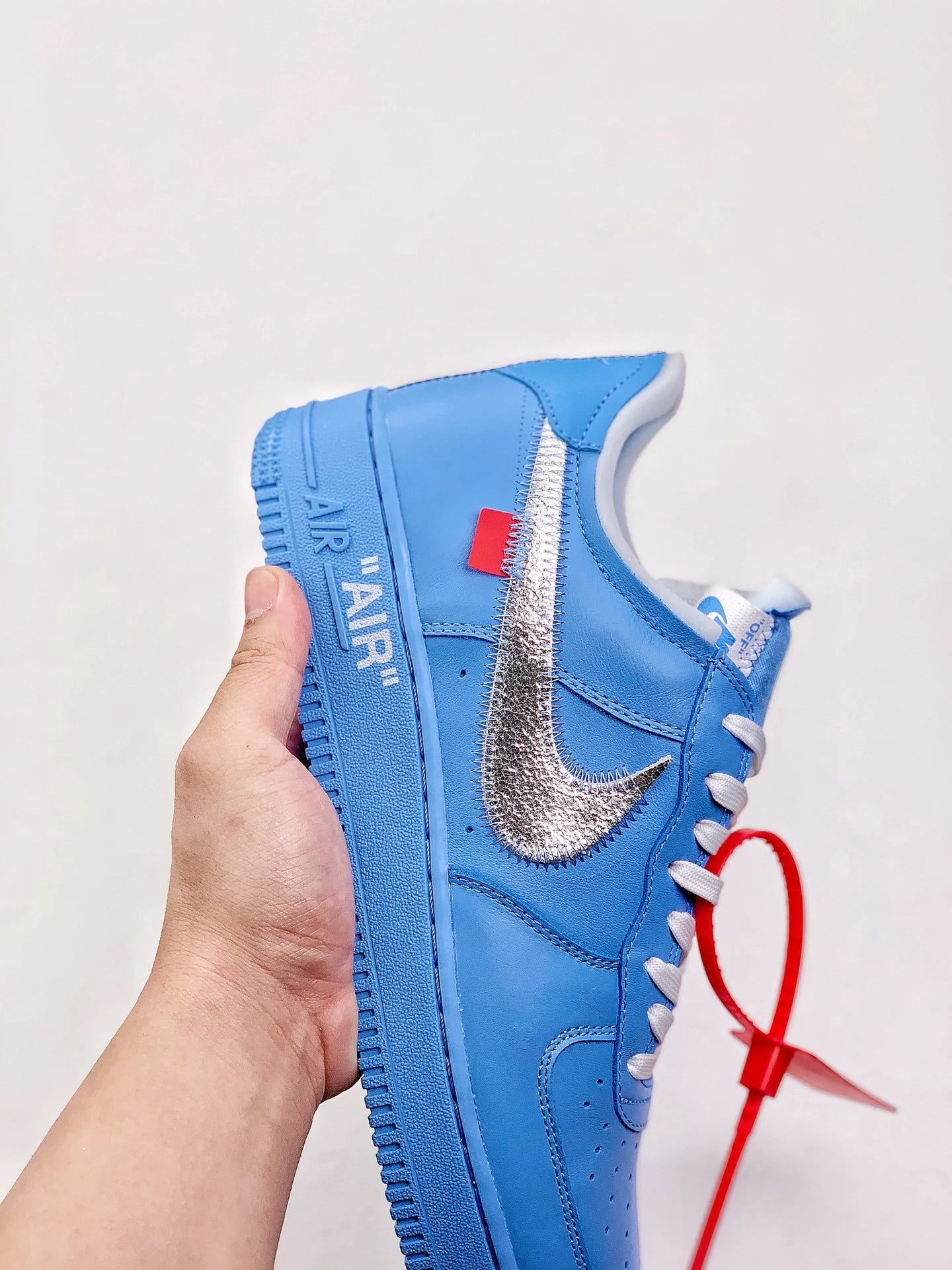 Blue sneakers with tag